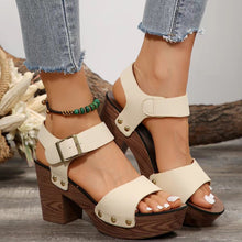 Model pose in ivory pair of Peep Toe Block Heel Sandals