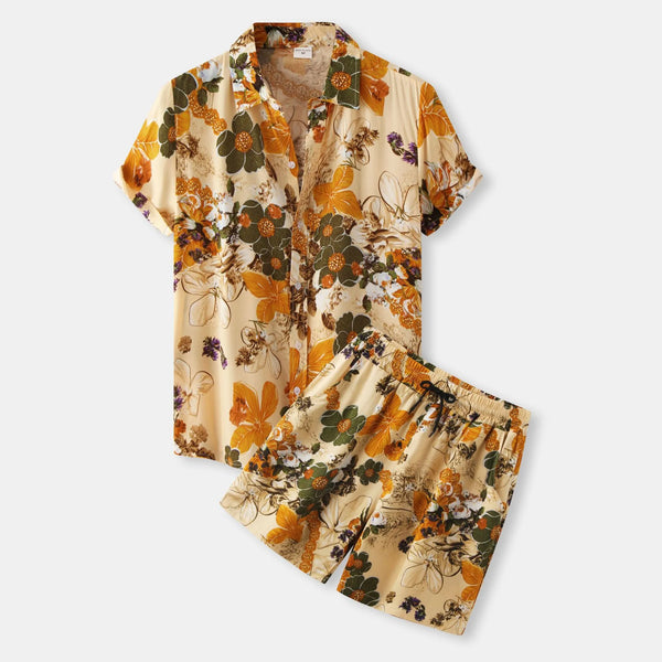 04a4f6e776b94de491503e60536d0583-Max-OriginFront flat lay of Javrenza Floral Edition Shorts Set in orange floral print, featuring button-up shirt and drawstring shorts.