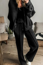 Kalorène Zip Up Long Sleeve Top and Pants Set in black, front view - exposed seam highlight