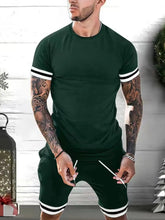 Men's plus size dark green Kavrix MotionSet front view on model.