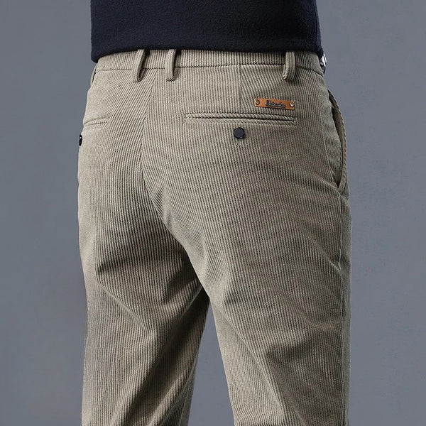 close-up back view of Khaki corduroy trousers on a gray background