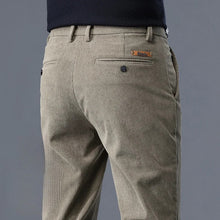 close-up back view of Khaki corduroy trousers on a gray background