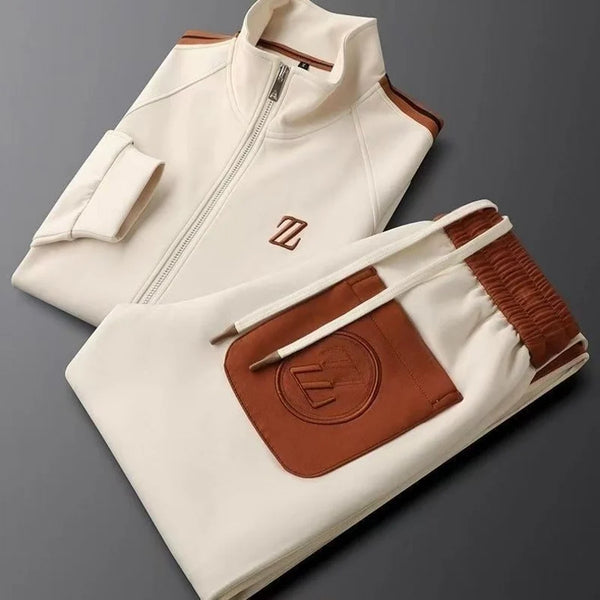 Neatly folded Varnox LuxeTrak jacket and pants set in Khaki.