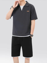 Grey Johnny collar top and shorts set on plus size model, front view with logo visible.