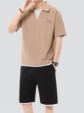 Plus size man wearing khaki Johnny collar top and shorts set, front view standing confidently with one hand in pocket.
