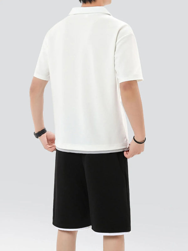 Back view of solid white Kyven CrestFlex set featuring short sleeve top and relaxed fit shorts on model.