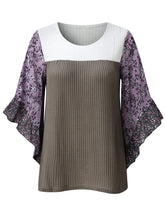 Front view of the BlossomEase Blouse in lavender to show floral sleeves and ruffle trim.
