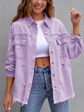 Close-up of model in a lavender CloudKitten Distressed Drop Shoulder Denim Jacket, featuring light distressing, drop shoulders, and button closure.
