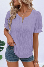 Model wearing lavender Wavelle Blouse paired with casual pants and accessories.