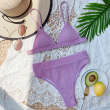 Front flat lay of lavender spaghetti strap ribbed bikini set displayed on hanger with adjustable straps