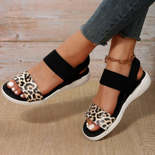 Model wearing PU Leather Open Toe Low Heel Sandals in leopard