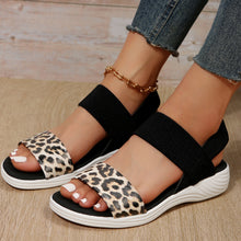 Model wearing PU Leather Open Toe Low Heel Sandals in leopard, side angle