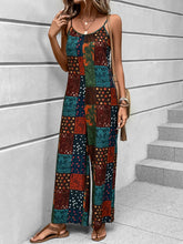 Silhouette-focused shot revealing the jumpsuit’s soft, draping fabric and multicolor print.
