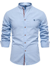 Front view of men’s light blue Aura Lift Zenith mandarin collar button-up shirt with foldable sleeves