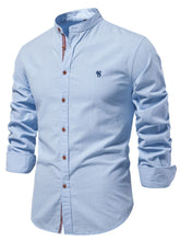 Side angle view of men’s light blue AuraLift Zenith mandarin collar button-up shirt highlighting sleeve detail