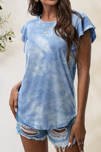 Model wearing light blue Printed Round Neck Short Sleeve T-Shirt with flutter sleeves.
