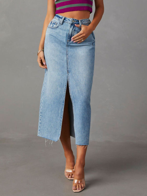 Front view of light blue Denvara Raw Hem Front Slit Washed Denim Midi Skirt styled with a contrast stripe crop top and heels