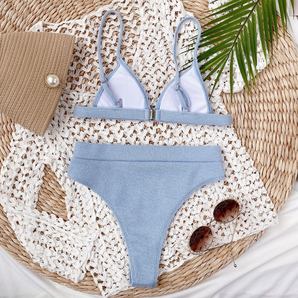 Back flat lay of light blue spaghetti strap ribbed bikini set showing back clasp closure and adjustable straps
