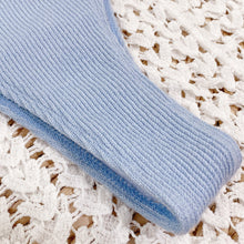 Close-up of light blue spaghetti strap bikini set ribbed texture 