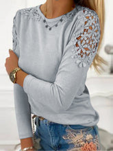 Model styled in light gray FloraFrost™ Tee with embroidered jeans and accessories for a formal look.