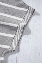 Close-up of soft striped knit fabric and knit trim detail on short sleeve top, in light gray.