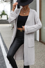Woman wearing light gray Thalora Cascade Cardigan with dropped shoulders.