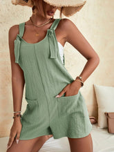 Light green romper styled with layered necklaces and espadrilles for a fresh, spring outfit.
