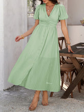 Light green Velunira dress styled for a casual wedding guest look.