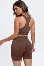 Back view of dark brown LineaFlow Vitality set showing bra straps and smooth pants fit.