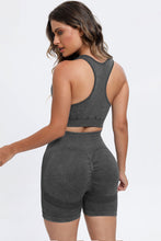 Back view of dark gray LineaFlow Vitality set showing bra straps and smooth pants fit.
