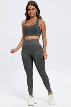 Model walking outdoors in dark gray LineaFlow Vitality set.
