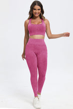 Model in deep rose LineaFlow Vitality set, front view highlighting square-neck crop top, wide‑strap bra, and high-waist pants.