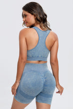 Back view of light blue LineaFlow Vitality set showing bra straps and smooth pants fit.