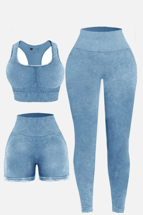 Flat lay of light blue LineaFlow Vitality set: square-neck top, bra, and high-waist pants.