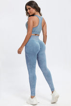 Rear view of woman lounging in light blue LineaFlow Vitality set.