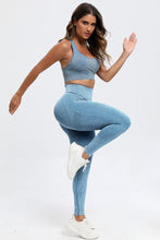 Side stretch pose in light blue LineaFlow Vitality set showcasing flexibility and fit.