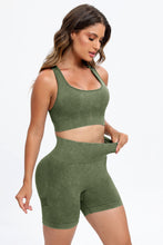 Woman in Moss LineaFlow Vitality set highlighting the supportive stretch fit.