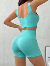 Back view of Mint Blue LumiCore BreezeActive set highlighting wide straps & smooth shorts fit.