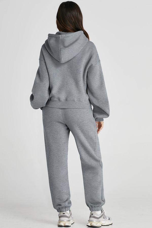 Back view of gray Lunetta DriftSet showing relaxed dropped shoulders and hood detail.