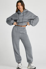 Close-up of soft gray Lunetta DriftSet fabric texture, elastic waist, and hoodie seam detail.