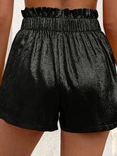 lustraflow women’s oversized satin black shorts close up back view showing fabric shine