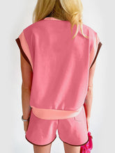 Back view of Lustressa™ Contrast Knit Shorts Set with bold trim in coral.