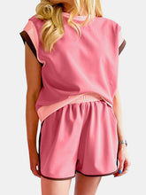 Model wearing coral Lustressa™ Contrast Knit Set with platform sandals.
