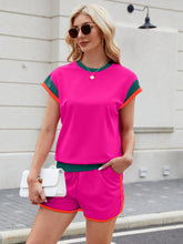 Model wearing Lustressa™ Contrast Set in hot pink styled with a white handbag, sandals, and hoop earrings.