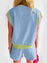 Back view of Lustressa™ Contrast Knit Shorts Set with bold trim, in light blue.