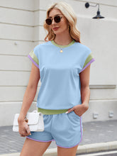 Model in light blue Lustressa™ Contrast Knit Set with white sneakers.