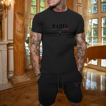 Close-up of onyx Luvéris Paris Crest Set showing 3D Paris print near grand piano.