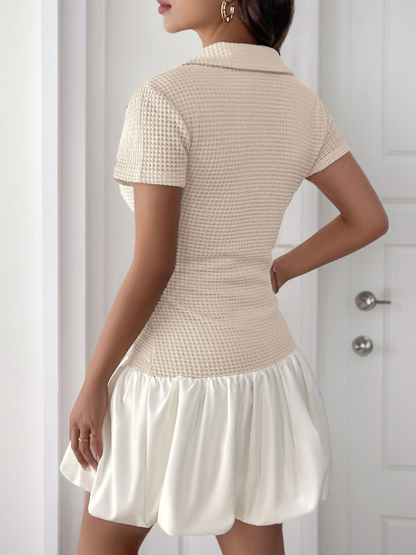 Back view of the Luxessity Johnny Collar Mini Dress in Tan, showcasing a smooth back design with a gently flared, relaxed fit hemline.