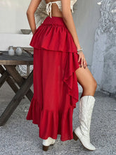 Back view of Lyvérielle Cascade Skirt in deep red showcasing ruched waist, back zip closure, and cascading layered ruffled back hem