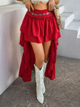 Close-up side front angle of Lyvérielle Cascade Skirt deep red highlighting ruched waist and micro-mini layered front